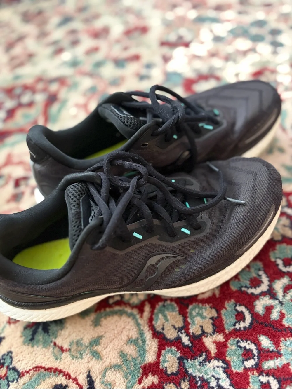 Saucony Black Running Shoes with Teal Accents